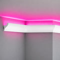 Close-up of ACL-006 white ceiling molding with a concealed pink LED light channel
