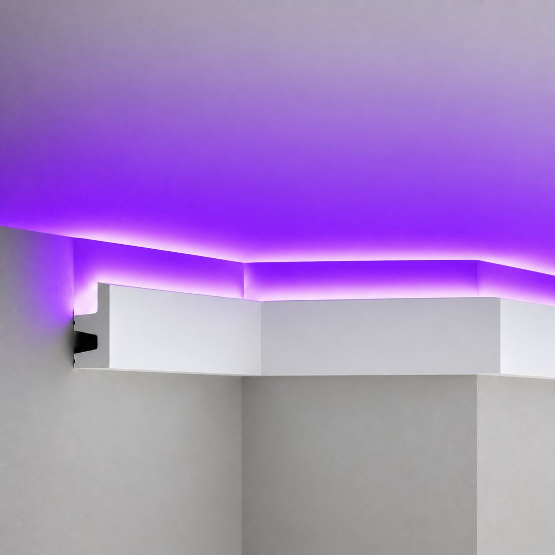 Close-up of ACL-009 white polymer crown molding with concealed purple LED illumination
