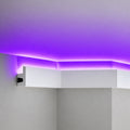 Close-up of ACL-009 white polymer crown molding with concealed purple LED illumination