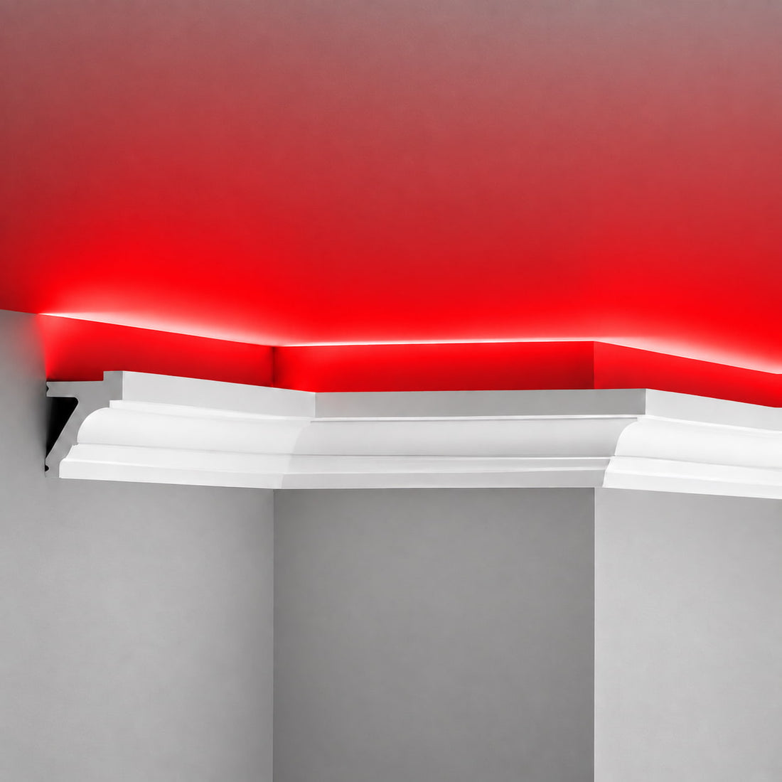 Close-up of ACL-011 polymer LED crown molding with hidden channel and red ceiling glow