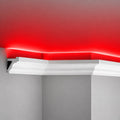 Close-up of ACL-011 polymer LED crown molding with hidden channel and red ceiling glow