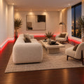 Luxury living room with ASL-001 LED baseboard and continuous red ambient floor lighting around the walls