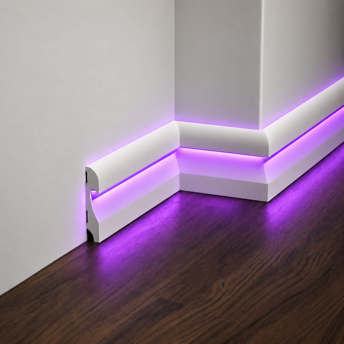 Close-up of ASL-002 paintable LED baseboard with hidden purple light channel and mitered corner joints