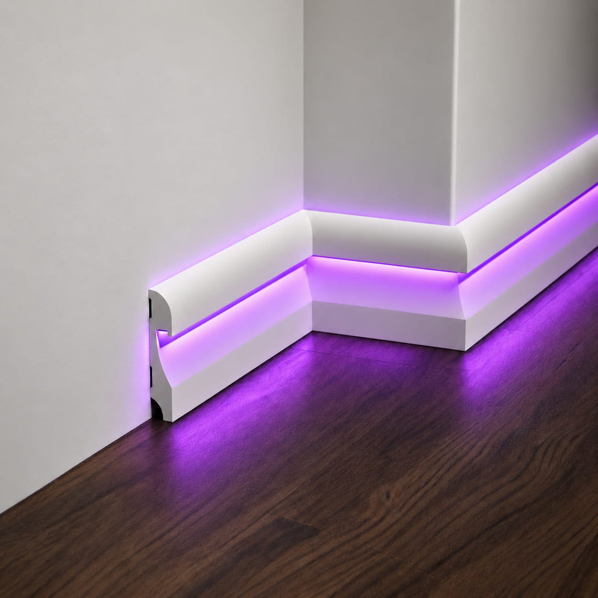 Close-up of ASL-002 paintable LED baseboard with hidden purple light channel and mitered corner joints