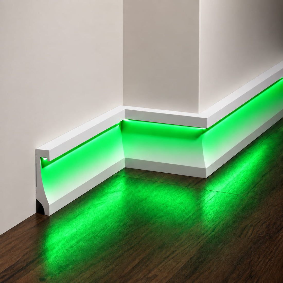 Close-up of ASL-004 white LED baseboard with a concealed green light channel and illuminated wood flooring