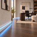 ASL-006 covered LED baseboard trim creating soft blue indirect lighting in a modern hallway